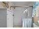 Updated shower with white tile and glass enclosure at 18147 Cadillac Ave, Port Charlotte, FL 33948