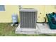 Well maintained AC unit and water pressure tank at 18204 Ackerman Ave, Port Charlotte, FL 33948
