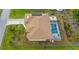 Aerial view showing house, pool, and landscaped yard at 18204 Ackerman Ave, Port Charlotte, FL 33948