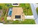 Aerial view of house, solar panels, pool, and landscaped yard at 18204 Ackerman Ave, Port Charlotte, FL 33948