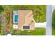 An aerial view showing a house with a pool and solar panels at 18204 Ackerman Ave, Port Charlotte, FL 33948