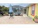 Spacious brick paved patio with pergola and grill at 18204 Ackerman Ave, Port Charlotte, FL 33948