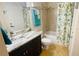 Updated bathroom with granite vanity, tub, and shower at 18204 Ackerman Ave, Port Charlotte, FL 33948