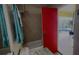 Bathroom with shower/tub combo, red door leading to pool at 18204 Ackerman Ave, Port Charlotte, FL 33948