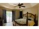 Spacious bedroom with a king-size bed and sliding glass doors leading to a patio at 18204 Ackerman Ave, Port Charlotte, FL 33948