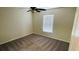 Well-lit bedroom with carpet and window blinds at 18204 Ackerman Ave, Port Charlotte, FL 33948