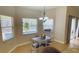 Bright dining area with wood floors and view of the pool at 18204 Ackerman Ave, Port Charlotte, FL 33948