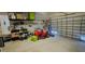 Garage with overhead storage and work bench area at 18204 Ackerman Ave, Port Charlotte, FL 33948