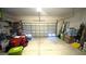 Attached garage with ample storage space for tools and equipment at 18204 Ackerman Ave, Port Charlotte, FL 33948