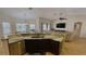 Kitchen island with granite countertop, sink, and stainless steel dishwasher at 18204 Ackerman Ave, Port Charlotte, FL 33948