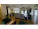 Open living space with hardwood floors, sectional sofa and pool access at 18204 Ackerman Ave, Port Charlotte, FL 33948