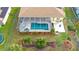 An aerial view of a screened-in pool and patio area at 18204 Ackerman Ave, Port Charlotte, FL 33948