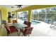 Relaxing pool area with patio furniture and screened enclosure at 18204 Ackerman Ave, Port Charlotte, FL 33948