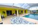 Inviting pool and patio with hammock and outdoor furniture at 18204 Ackerman Ave, Port Charlotte, FL 33948