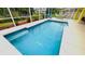Refreshing blue swimming pool with tiled coping and steps at 18204 Ackerman Ave, Port Charlotte, FL 33948