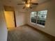 Bright bedroom with ample closet space and carpet at 2061 Willow Hammock Cir # 106, Punta Gorda, FL 33983