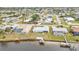 Aerial view showing home's location, waterfront access, and neighborhood at 226 Spring Lake Nw Blvd, Port Charlotte, FL 33952