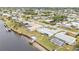 Aerial view of canal front property with large backyard and dock at 226 Spring Lake Nw Blvd, Port Charlotte, FL 33952