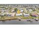 Aerial view of canal front home with private dock and pool at 226 Spring Lake Nw Blvd, Port Charlotte, FL 33952