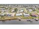 Aerial view of waterfront home with private docks and screened pool at 226 Spring Lake Nw Blvd, Port Charlotte, FL 33952