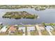 Wide view of waterfront homes and surrounding landscape at 226 Spring Lake Nw Blvd, Port Charlotte, FL 33952