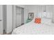 Bedroom with flamingo bedding, white closet, and teal dresser at 226 Spring Lake Nw Blvd, Port Charlotte, FL 33952