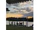Private dock with seating area overlooking the water at 226 Spring Lake Nw Blvd, Port Charlotte, FL 33952
