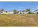 Single story home with a large front yard and palm trees at 226 Spring Lake Nw Blvd, Port Charlotte, FL 33952