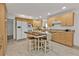 Kitchen with light wood cabinets, island, and tiled floor at 226 Spring Lake Nw Blvd, Port Charlotte, FL 33952