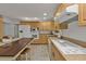 Kitchen with light wood cabinets, island, and built in microwave at 226 Spring Lake Nw Blvd, Port Charlotte, FL 33952