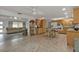 Open kitchen with wood cabinets, island, and view of living room at 226 Spring Lake Nw Blvd, Port Charlotte, FL 33952