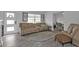 Spacious living room with beige recliner sofas, tile floors, and a fireplace at 226 Spring Lake Nw Blvd, Port Charlotte, FL 33952
