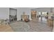 Living room with beige couch and view into kitchen and dining areas at 226 Spring Lake Nw Blvd, Port Charlotte, FL 33952
