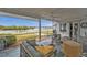 Screened porch with water views and comfortable seating at 226 Spring Lake Nw Blvd, Port Charlotte, FL 33952