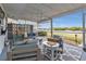 Screened porch with water views and comfortable seating at 226 Spring Lake Nw Blvd, Port Charlotte, FL 33952