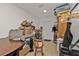 Small storage room with a table, chair, and various boxes at 226 Spring Lake Nw Blvd, Port Charlotte, FL 33952