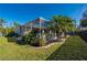 Expansive backyard showcasing the pool and home at 23511 Lark Ave, Port Charlotte, FL 33954