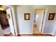 Small bathroom with toilet and adjacent to a hallway at 2824 Caribbean Dr, Punta Gorda, FL 33950