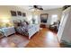 Spacious bedroom with hardwood floors and a king-size bed at 2824 Caribbean Dr, Punta Gorda, FL 33950