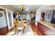 Bright dining room with hardwood floors and view into living room at 2824 Caribbean Dr, Punta Gorda, FL 33950