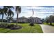 Beautiful home with lush landscaping and circular driveway at 2824 Caribbean Dr, Punta Gorda, FL 33950