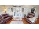 Bright living room with hardwood floors and comfortable leather furniture at 2824 Caribbean Dr, Punta Gorda, FL 33950