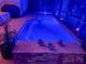 Inviting pool at night with colorful underwater lighting at 2824 Caribbean Dr, Punta Gorda, FL 33950
