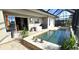 Pool area with patio furniture and outdoor kitchen access at 2824 Caribbean Dr, Punta Gorda, FL 33950
