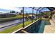 Relaxing pool and spa with screened enclosure and canal views at 2824 Caribbean Dr, Punta Gorda, FL 33950