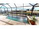 Enclosed heated pool with spa and canal views at 2824 Caribbean Dr, Punta Gorda, FL 33950