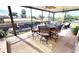 Screened patio with outdoor dining furniture and canal views at 2824 Caribbean Dr, Punta Gorda, FL 33950
