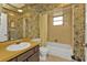Bathroom with shower/tub combo and floral wallpaper at 3114 Magdalina Dr, Punta Gorda, FL 33950