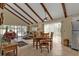 Bright dining area with wood beams and access to the pool area at 3114 Magdalina Dr, Punta Gorda, FL 33950