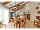 Bright dining area with wood table and chairs, adjacent to kitchen at 3114 Magdalina Dr, Punta Gorda, FL 33950